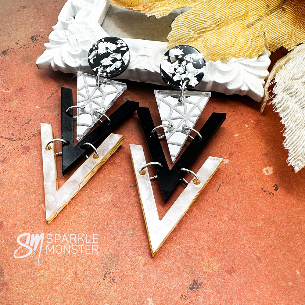 Nagel dangle earrings, spider webs