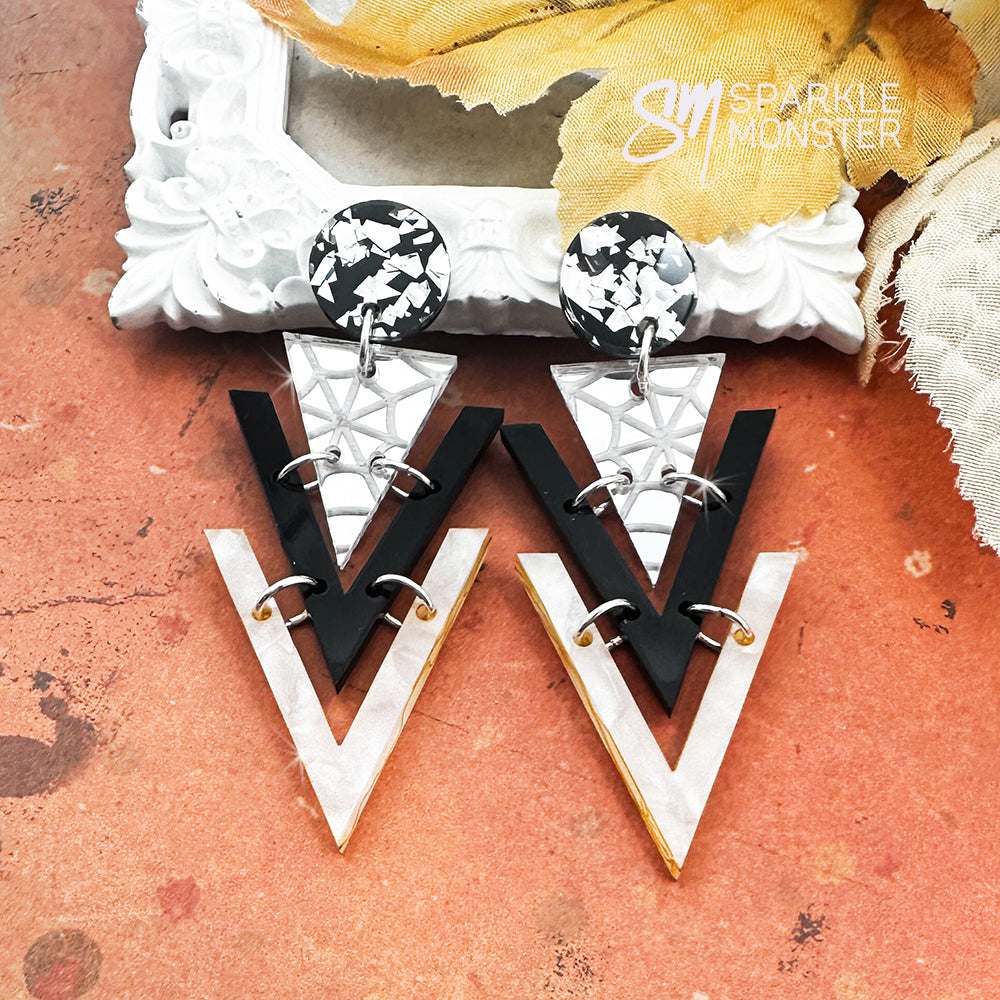 Nagel dangle earrings, spider webs