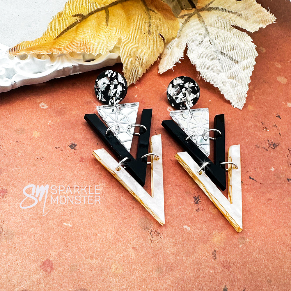 Nagel dangle earrings, spider webs