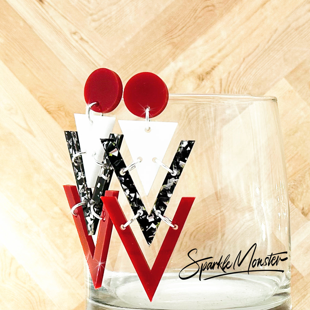 Nagel dangle earrings in red, white, and black