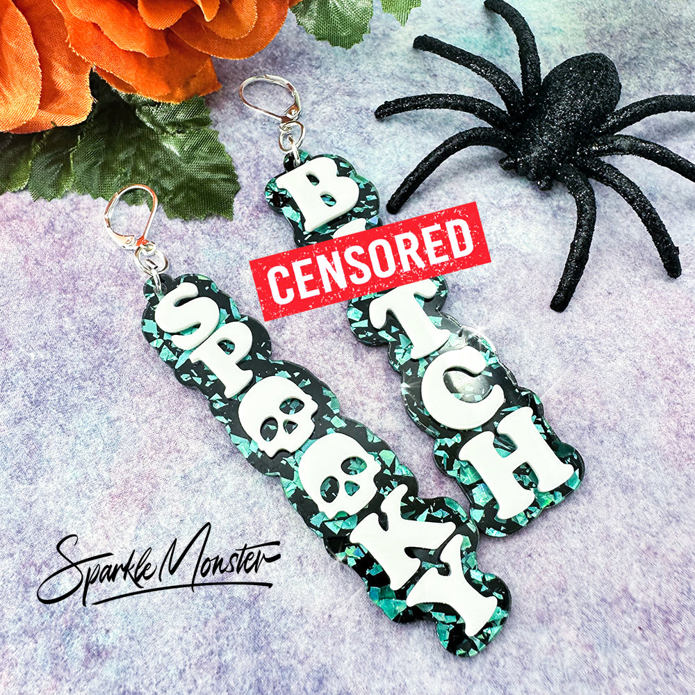 Spooky B*tch dangle earrings, laser cut acrylic, turquoise confetti glitter