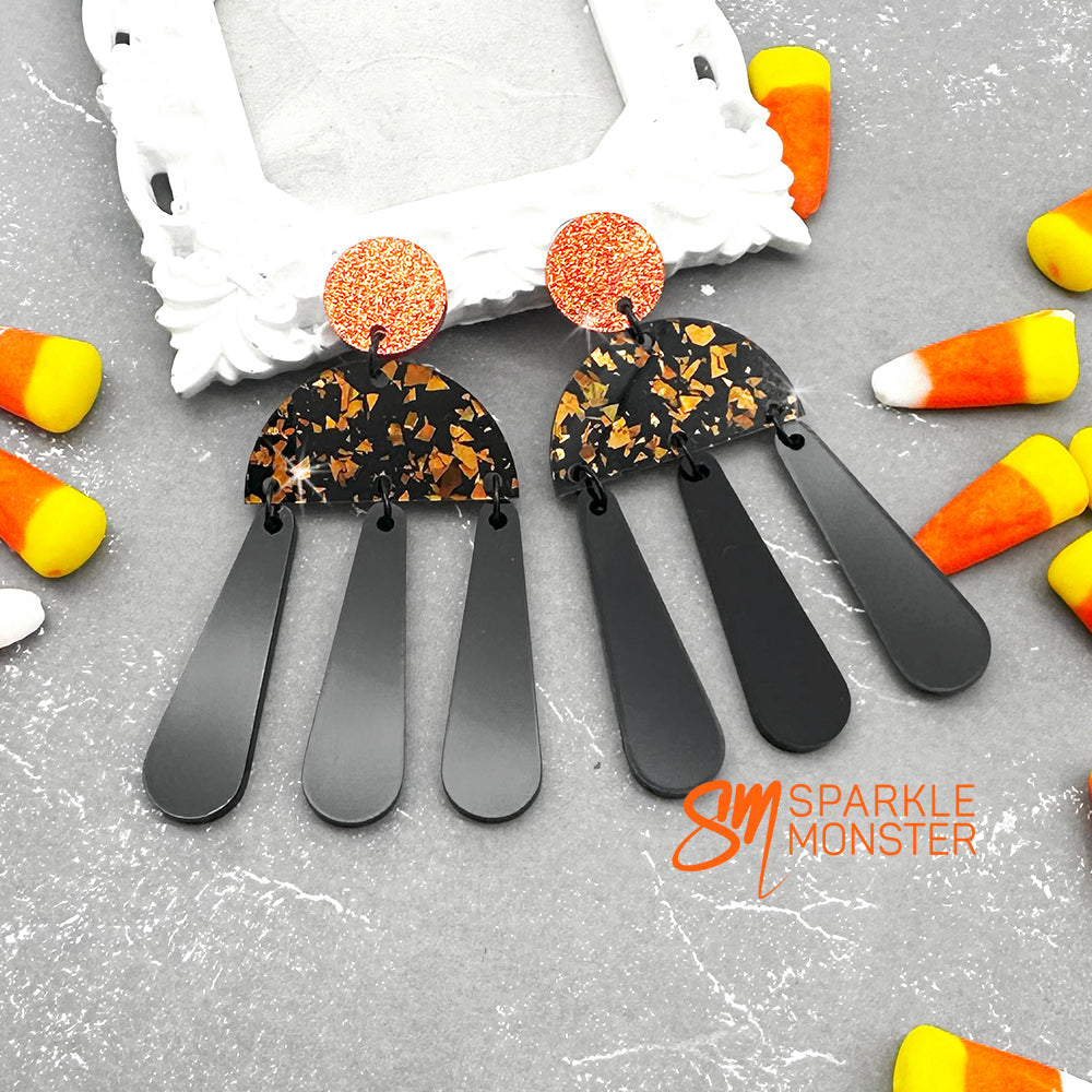 Aura dangle earrings, orange and black