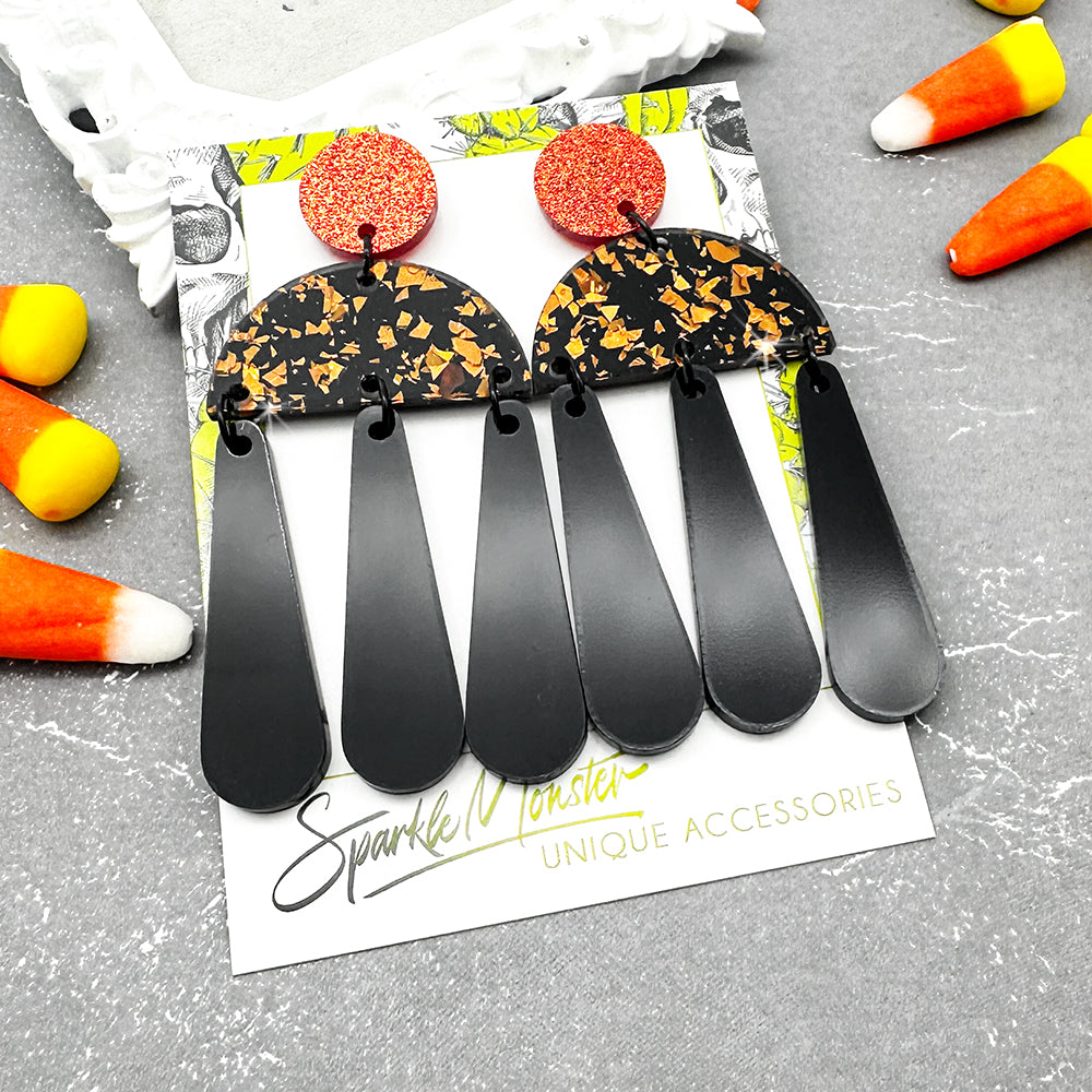 Aura dangle earrings, orange and black