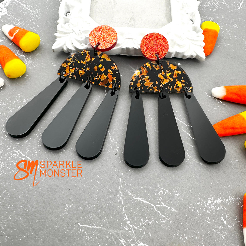 Aura dangle earrings, orange and black