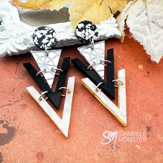 Nagel dangle earrings, spider webs