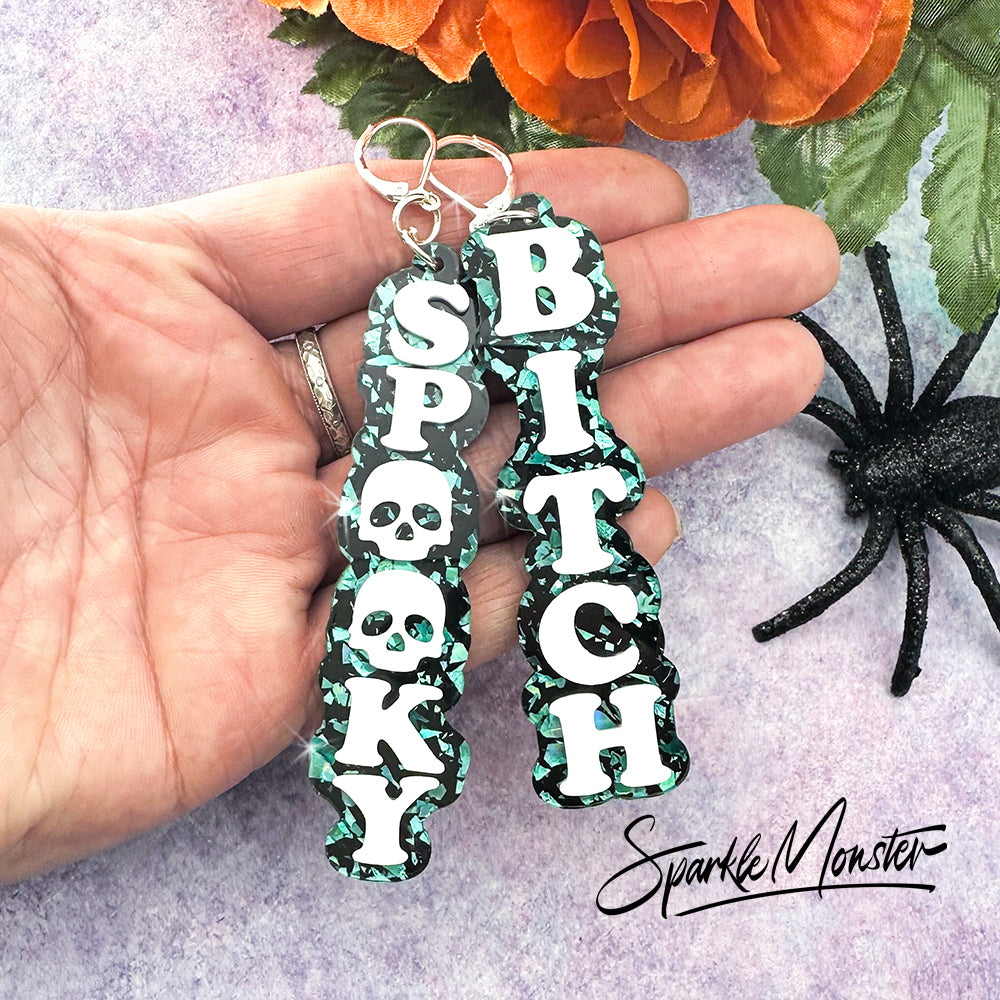 Spooky B*tch dangle earrings, laser cut acrylic, turquoise confetti glitter