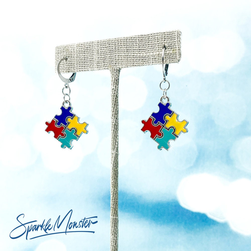 Autism Puzzle Piece Hoops or Huggies Earrings, silver toned hoops, hinged, blue, red, yellow, awareness